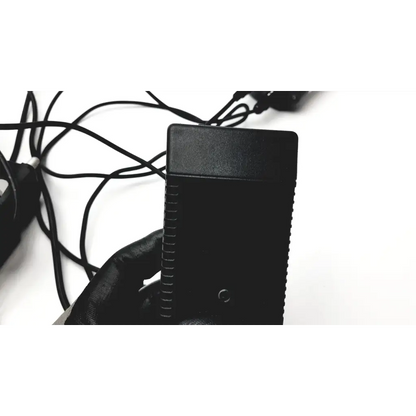 Black plastic power adapter with textured ridges and circular indentation for keeler vantage plus led bio ophthalmoscope