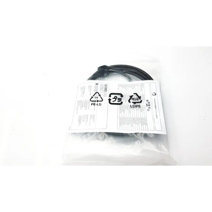 Black coiled cable in clear plastic packaging with recycling label for kensington master keyed laptop lock k65042m