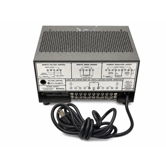 Black metal kepco abc series regulated dc power supply rear panel with perforated vents and labeled control sections