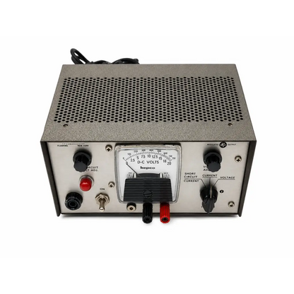 Gray metal kepco abc series regulated dc power supply with black knobs red black terminals and analog dc volts meter
