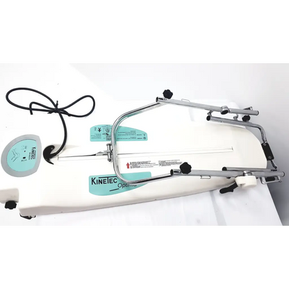 White kinetec optima ability knee rehabilitation machine with chrome metal frame and black adjustment knobs