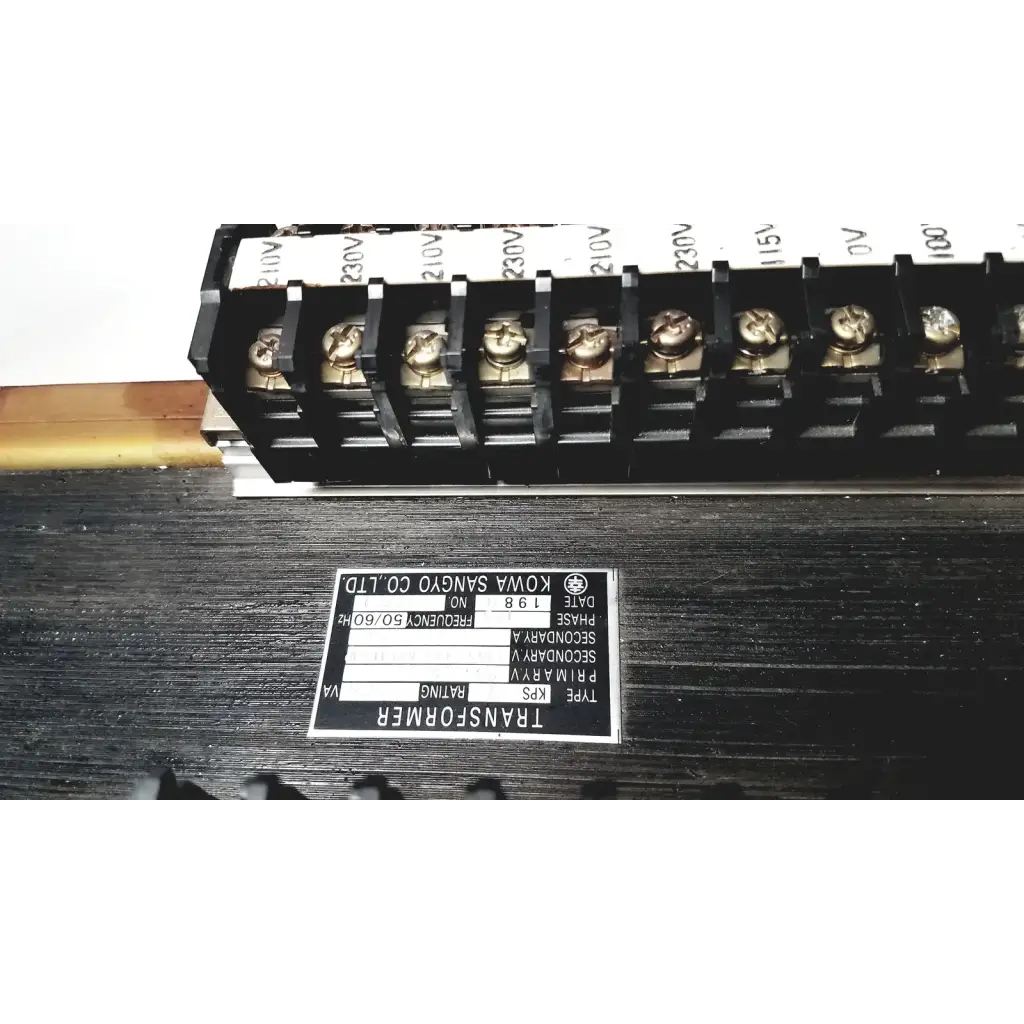 Black rectangular kowa sangyo power transformers label with white text and logo displaying technical specifications