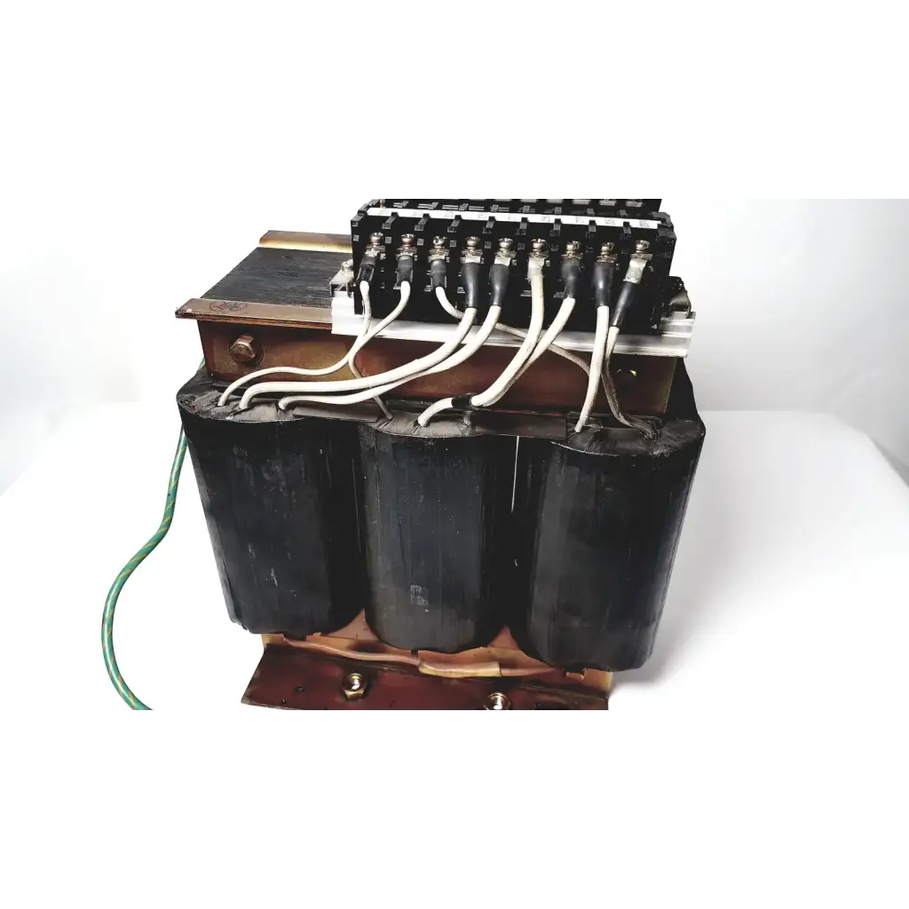 Black cylindrical power transformer by Kowa Sangyo with copper windings and white insulated wires for reuse medical applications