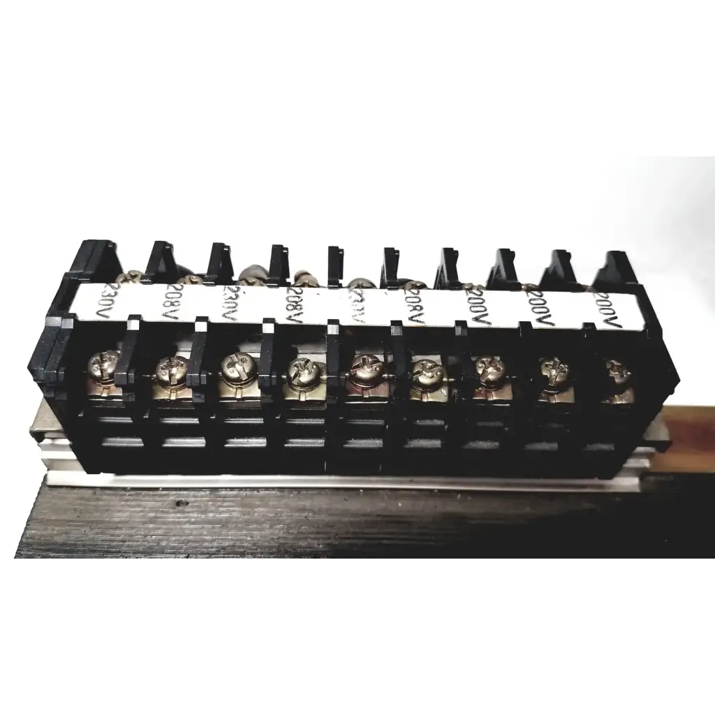 Black plastic terminal block with silver screws and voltage labels for kowa sangyo power transformers in reuse medical settings