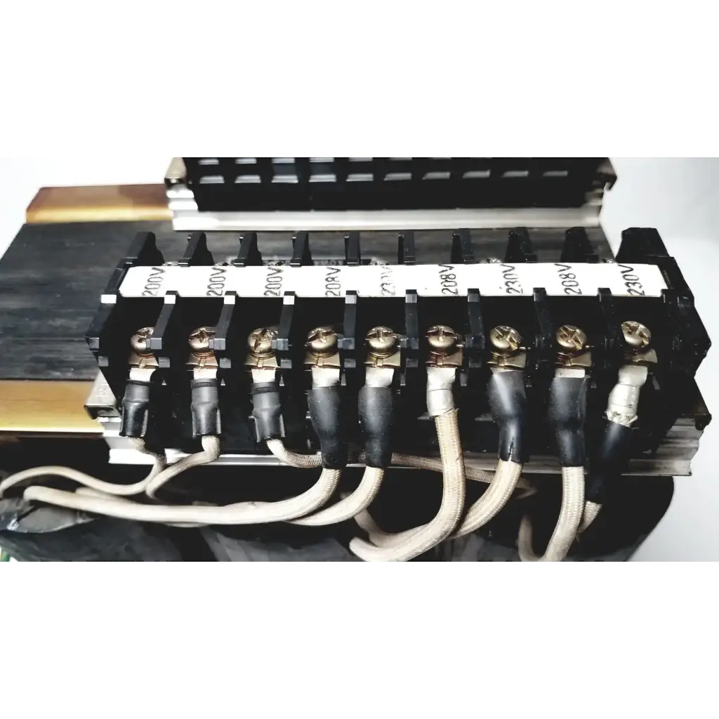 Black electrical terminal block with gold screws and labeled insulators for 208v connected to kowa sangyo power transformers