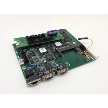 Green circuit board with black integrated circuits blue capacitors and metallic connectors on la3 logic transition pcba