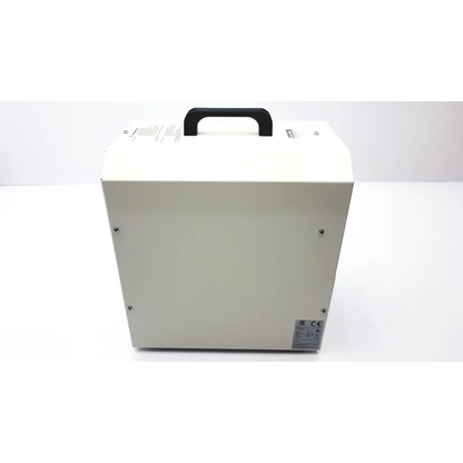 White rectangular industrial-grade laerdal dss 110-2 air compressor with black handle and certification labels visible
