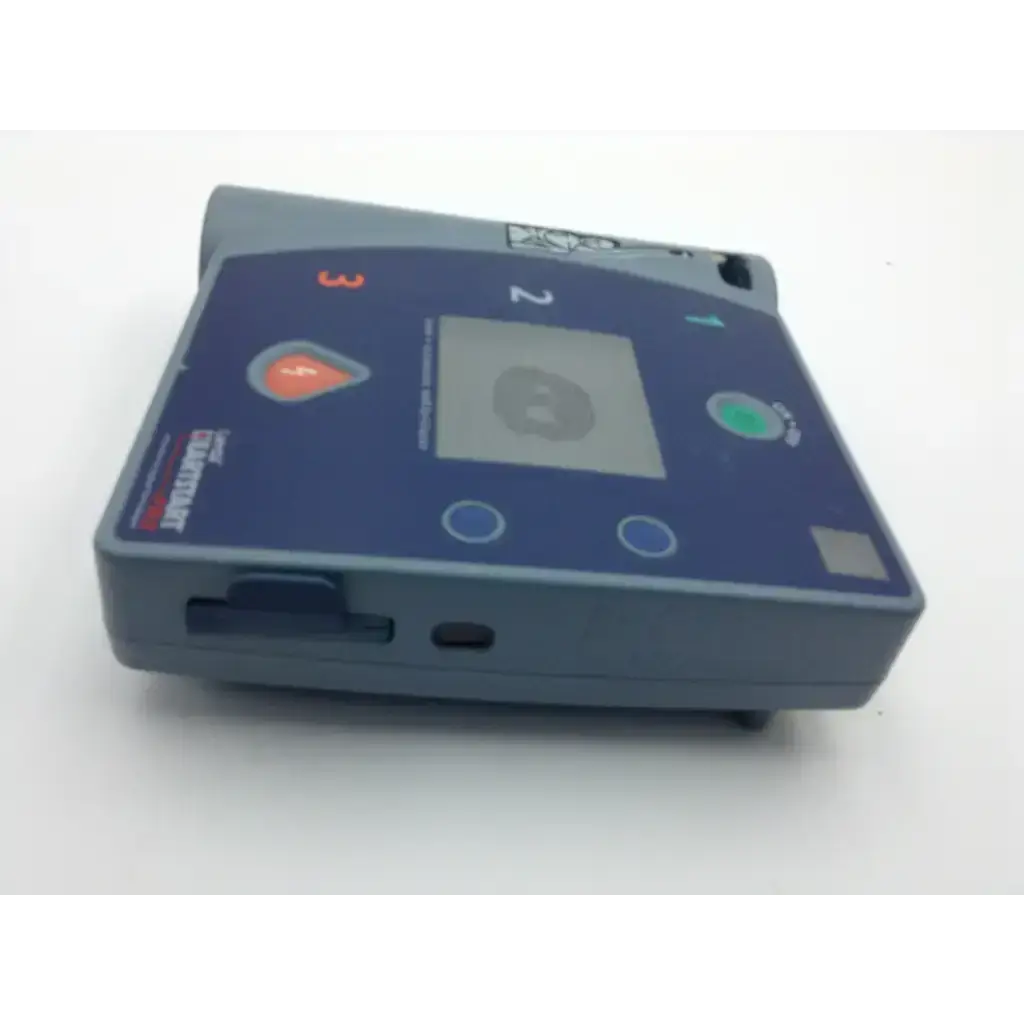 Blue and gray laerdal heartstart fr2 defibrillator with digital screen orange and green buttons and zoll logo on side