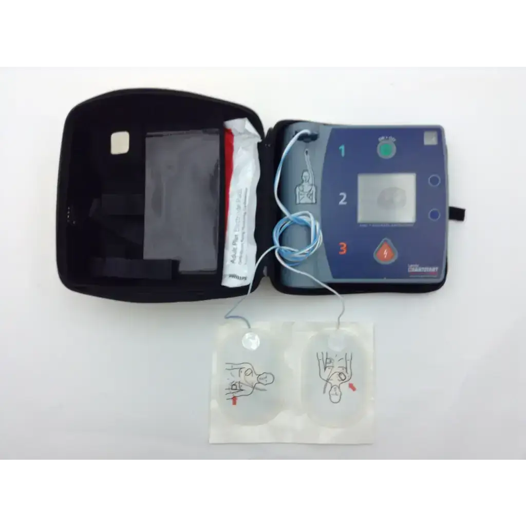Laerdal heartstart fr2 automated external defibrillator in blue and gray with electrode pads in black carrying case