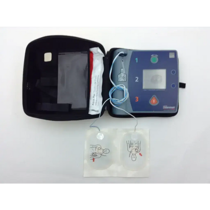 Laerdal heartstart fr2 automated external defibrillator in blue and gray with electrode pads in black carrying case
