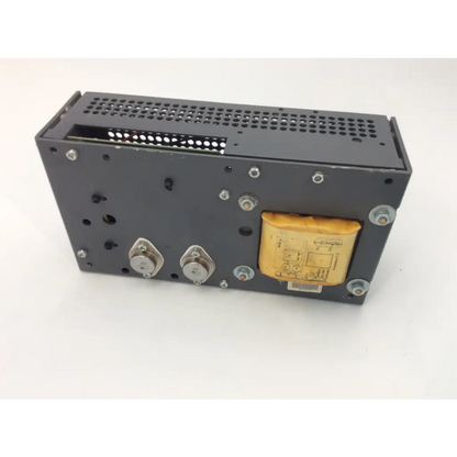 Black metal lambda power supply lns-w-5-ov with perforated ventilation grille and yellow capacitor on the side