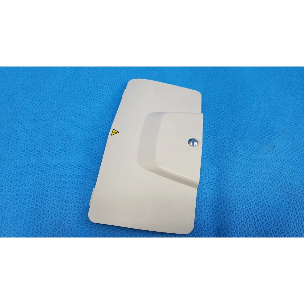 Off-white plastic lamp house cover panel with silver screw and yellow warning triangle for topcon trc-nw6s retinal camera