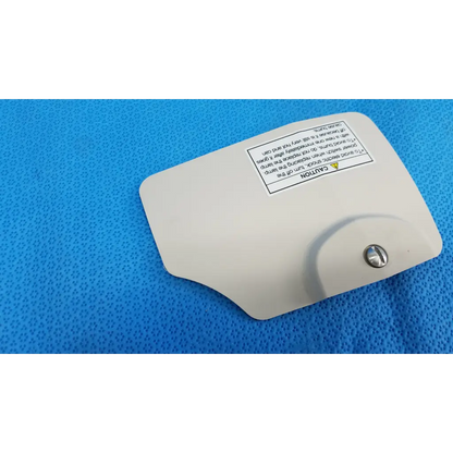 White plastic lamp house cover panel with metallic screw and warning label for topcon trc-nw8 retinal camera