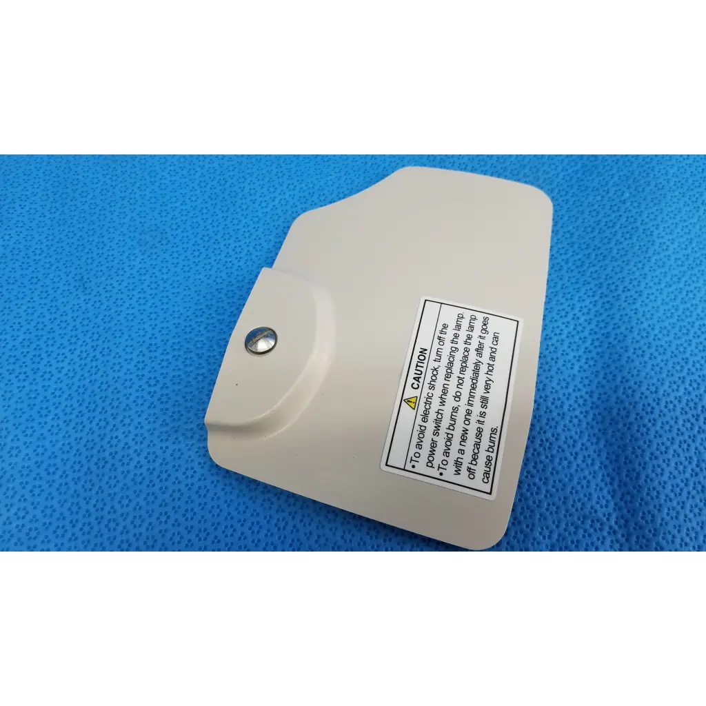Beige plastic lamp house cover panel with silver screw and caution label for topcon trc-nw8 retinal camera