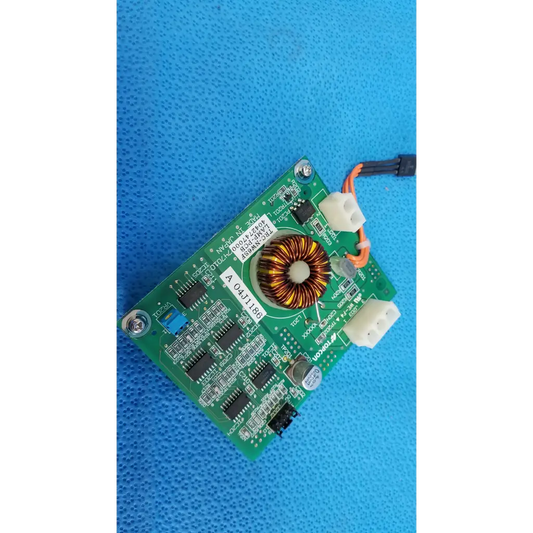 Green illumination circuit board with central toroidal copper inductor and black integrated circuits for topcon retinal camera