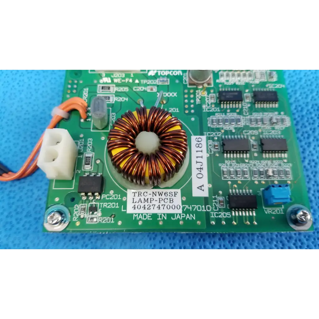 Green printed circuit board with central toroidal copper inductor yellow insulation for topcon trc-nw6sf illumination circuit board