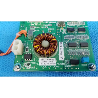 Green printed circuit board with central toroidal copper inductor yellow insulation for topcon trc-nw6sf illumination circuit board