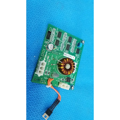 Green illumination circuit board with black ICs, toroidal inductor, white connectors, and orange-black cable for Topcon camera