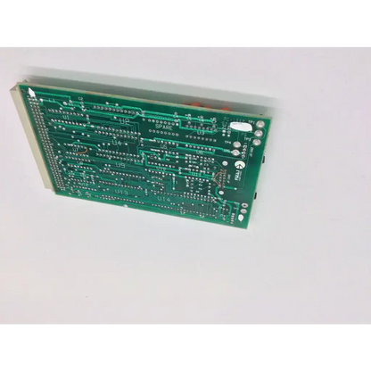 Green printed circuit board with silver soldered components and labeled connectors from laser industries bbcf6-9 pc 1002 524