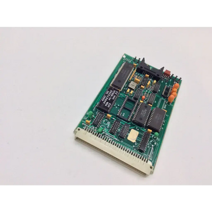 Green printed circuit board with black integrated circuits and orange connectors in laser industries pc 1002 524 bbcf6-9