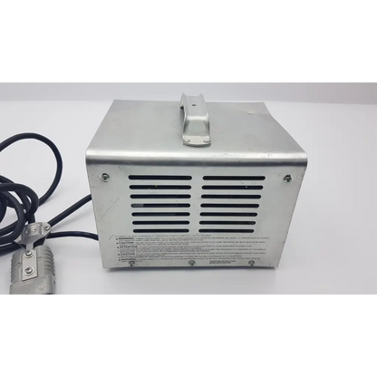 Silver metallic fully automatic battery charger lester electrical lestronic ii with black ventilation slits and handle on top
