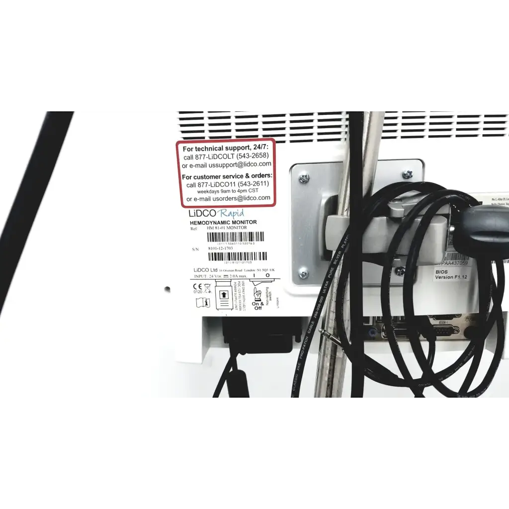 White plastic lidco hm-81-01 rapid hemodynamic monitor with power supply black cables and silver metal bracket