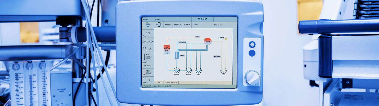 Light blue medical monitor displaying a schematic diagram on its screen.