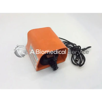 Orange rectangular line master guard foot pedal with black cable and silver spherical component for full guard use