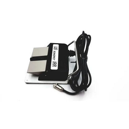 Black and silver us sononet irr ultrasonic cleaning machine with coiled black power cord from linemaster switch corporation claasic iv foot switch