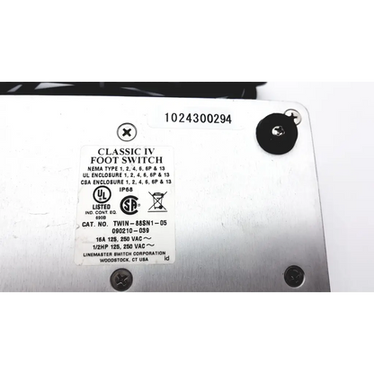 Silver metallic claasic iv foot switch by linemaster switch corporation with labeled specifications and certifications