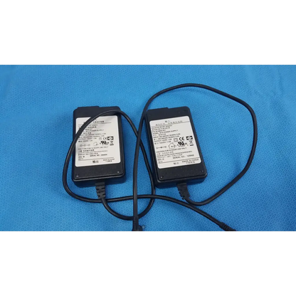 Lot of 2 black elpac electronics 3610 universal adapter power supply units with coiled cords and white label stickers