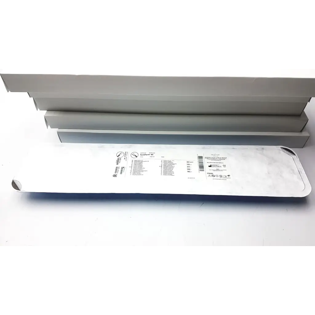 White plastic-wrapped intuitive da vinci lot of 5 stapler 12mm curved-tip packaging with printed labels and barcode