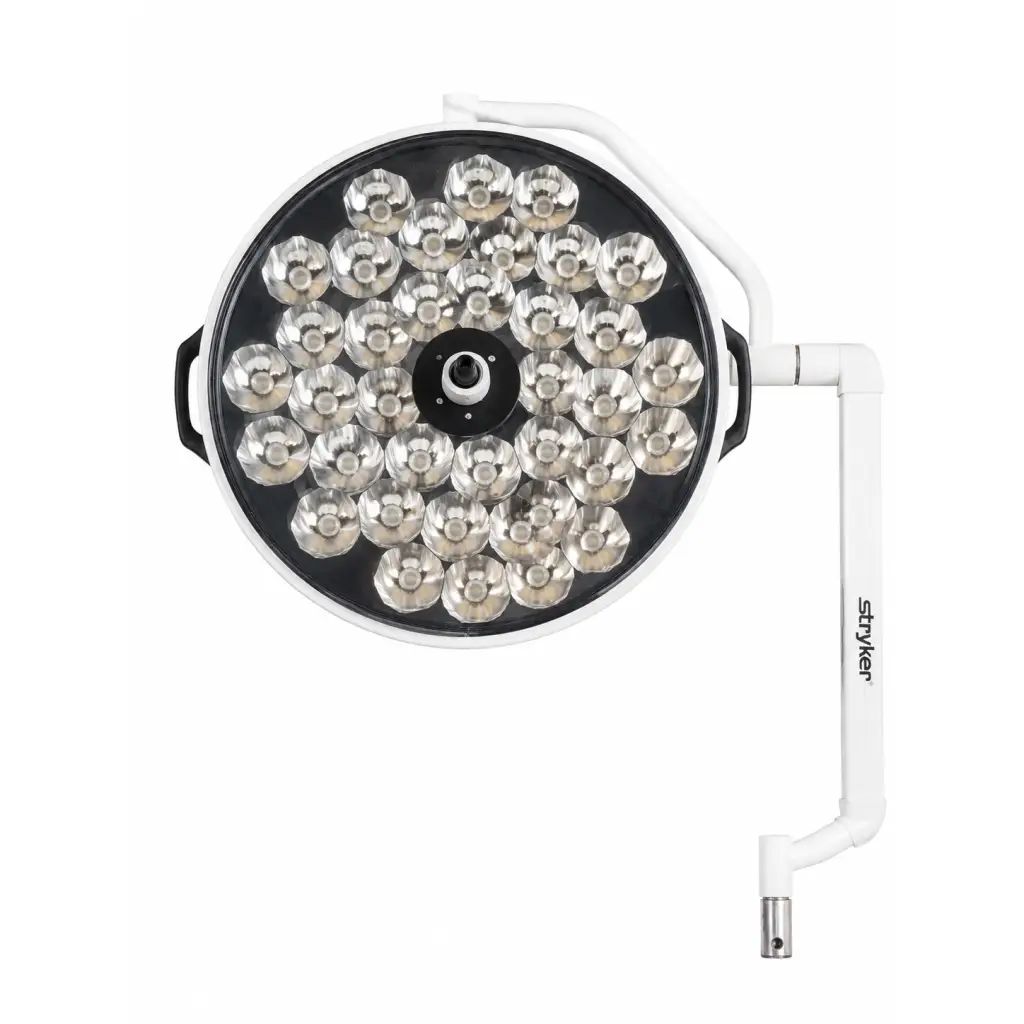 White circular biomed certified Stryker Berchtold Visum II surgical light head with silver LED bulbs on adjustable arm