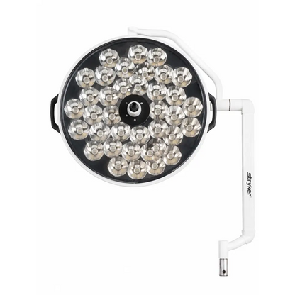 White circular biomed certified Stryker Berchtold Visum II surgical light head with silver LED bulbs on adjustable arm