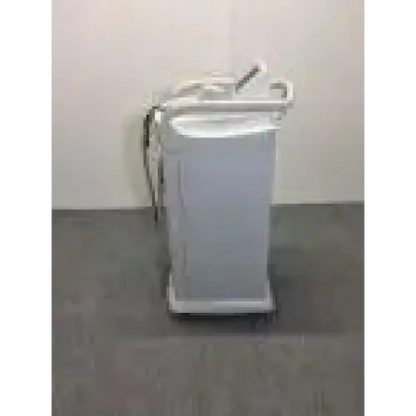 White plastic laundry cart with metal handle and wheels next to lumenis lightsheer 5390 laser ipl device