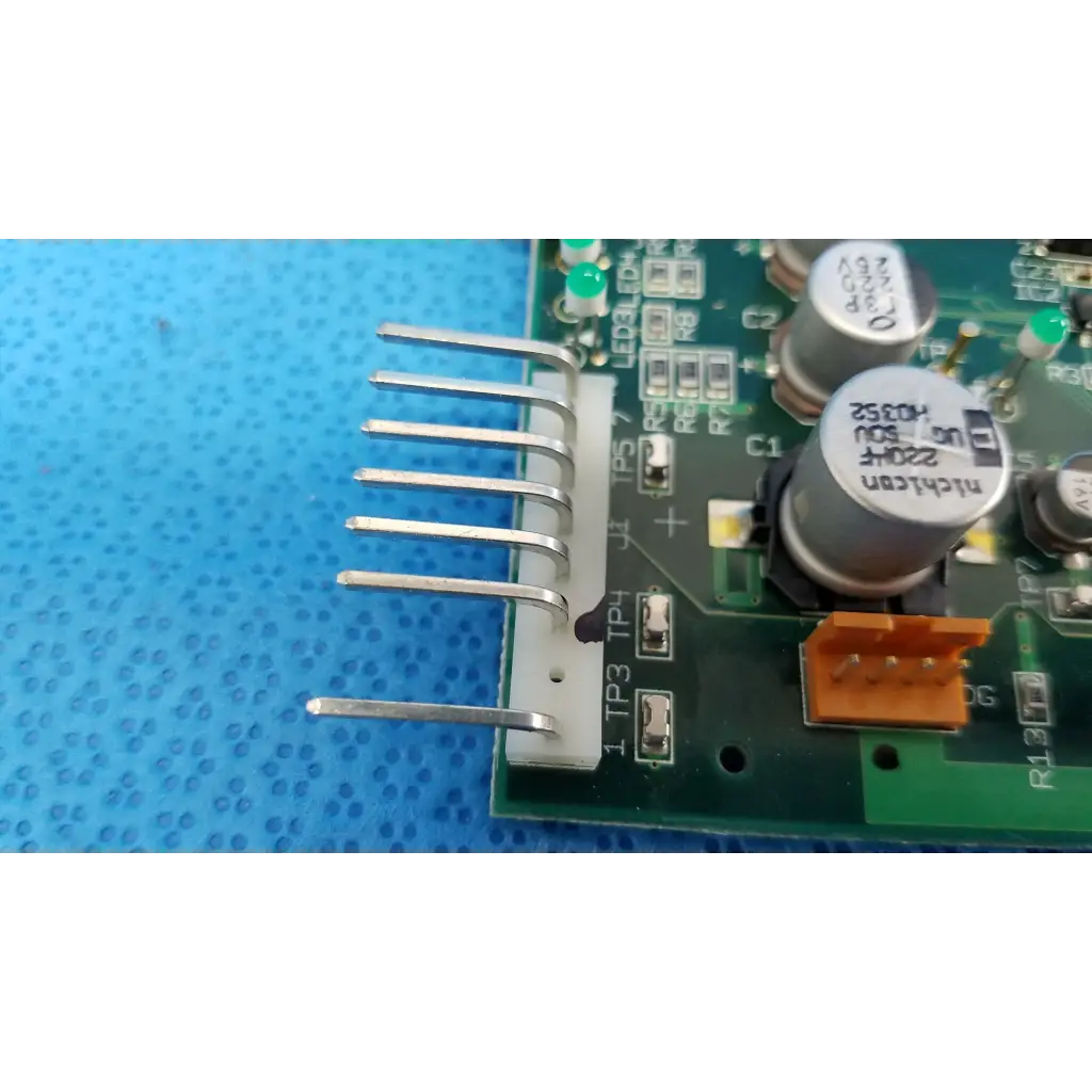 White plastic connector with six silver pins on green motherboard circuit board for topcon trc-nw6s retinal camera