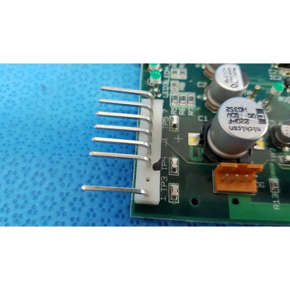 White plastic connector with six silver pins on green motherboard circuit board for topcon trc-nw6s retinal camera