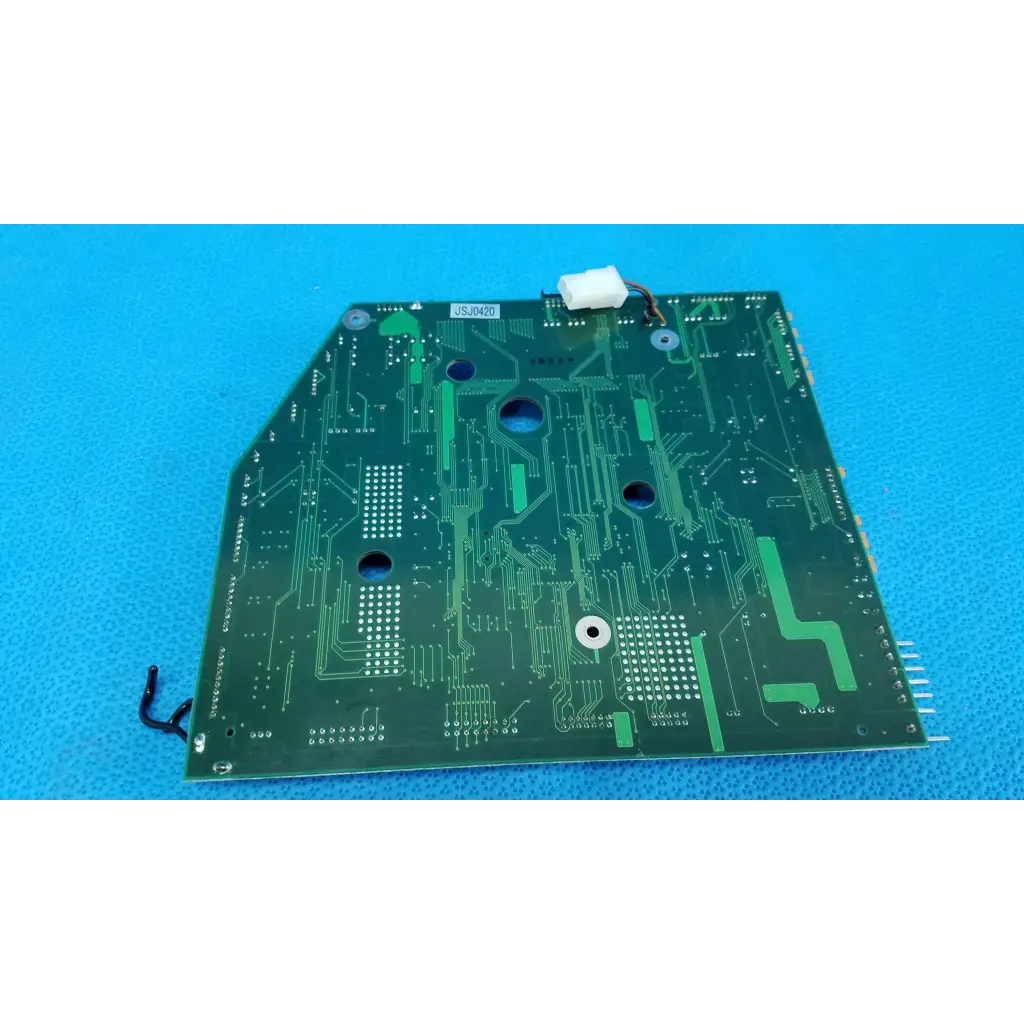 Green motherboard circuit board with intricate copper traces and mounting holes for topcon trc-nw6s retinal camera