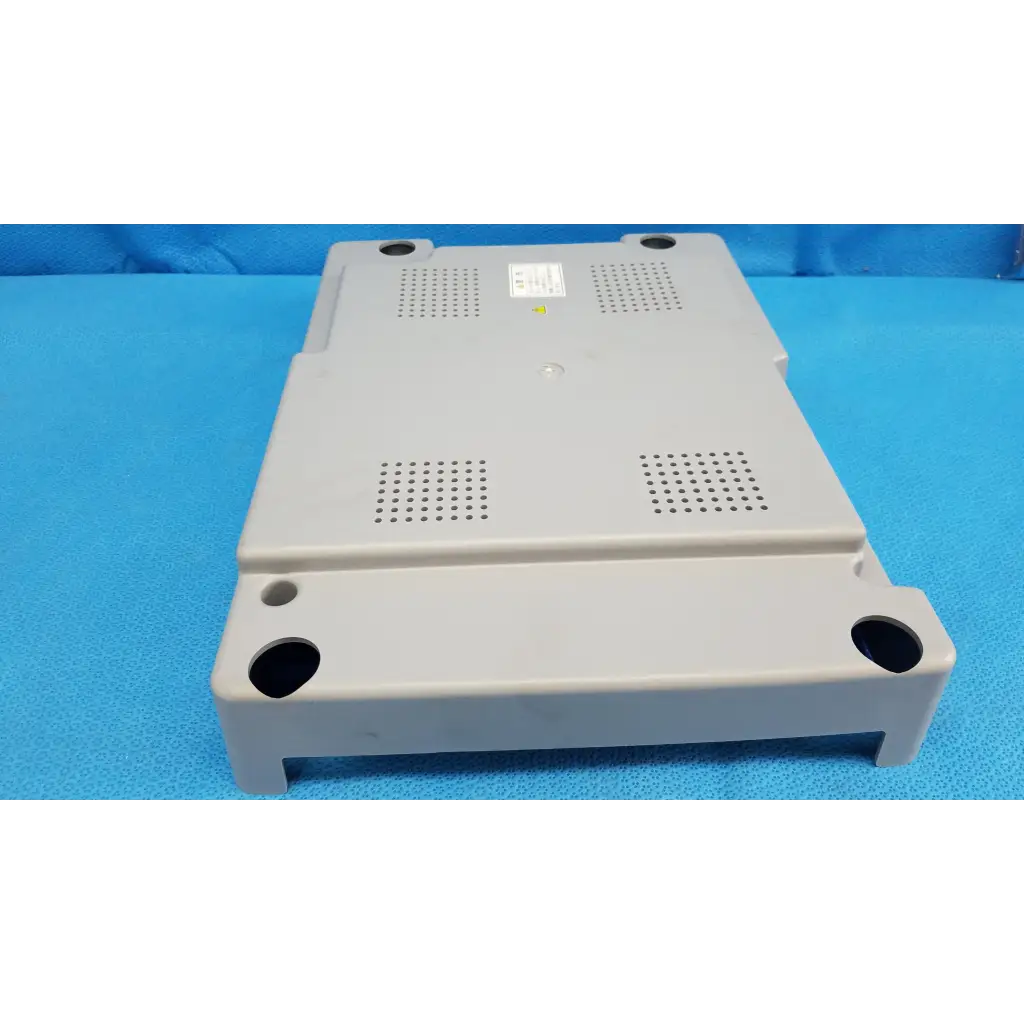 Gray plastic main unit bottom cover panel with ventilation grilles and mounting holes for topcon trc-nw8 retinal camera