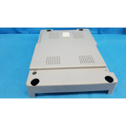 Gray plastic main unit bottom cover panel with ventilation grilles and mounting holes for topcon trc-nw8 retinal camera