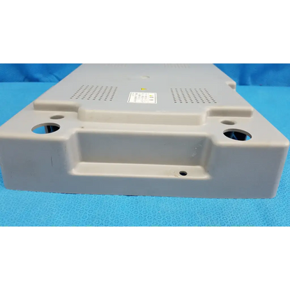 Beige plastic main unit bottom cover panel with ventilation and mounting holes for Topcon TRC-NW8 retinal camera back side