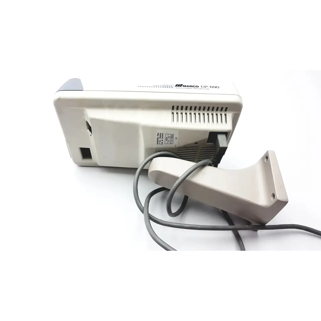 Beige marco cp-690 auto chart projector with matching handheld barcode scanner and gray cables for chart projector use