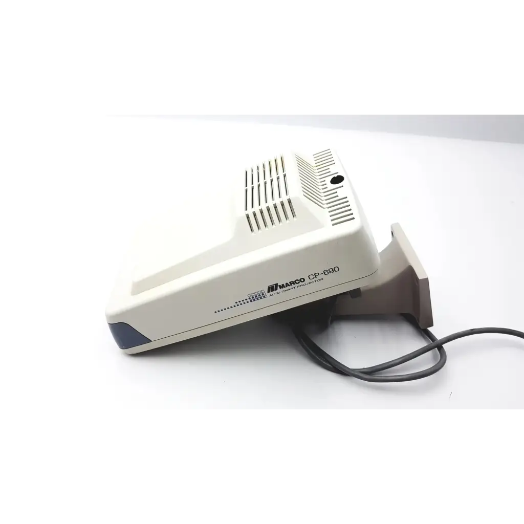 Beige plastic marco cp-690 auto chart projector with dark gray accent and ventilation slits on top surface