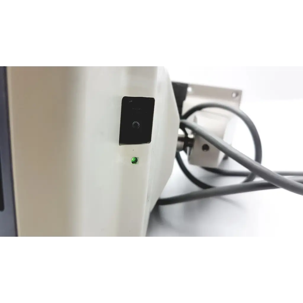 White marco cp-690 auto chart projector with black power switch and illuminated green indicator light