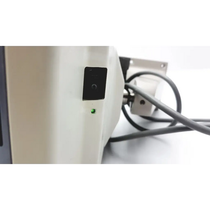 White marco cp-690 auto chart projector with black power switch and illuminated green indicator light