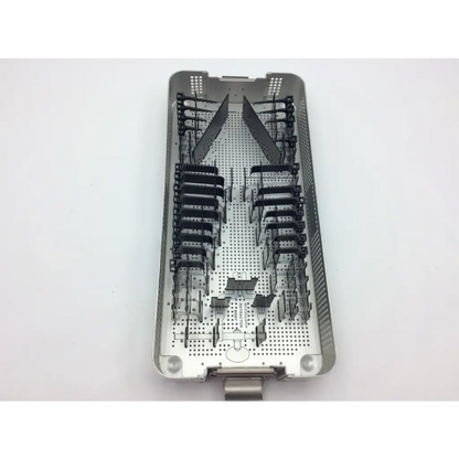 Stainless steel mcculloch retractor instrument tray with black plastic holders and perforated design for surgical use
