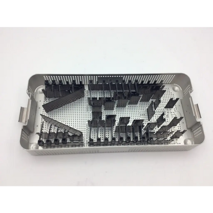 Silver mcculloch retractor instrument tray with black plastic organizers and perforated metal sides for surgical use