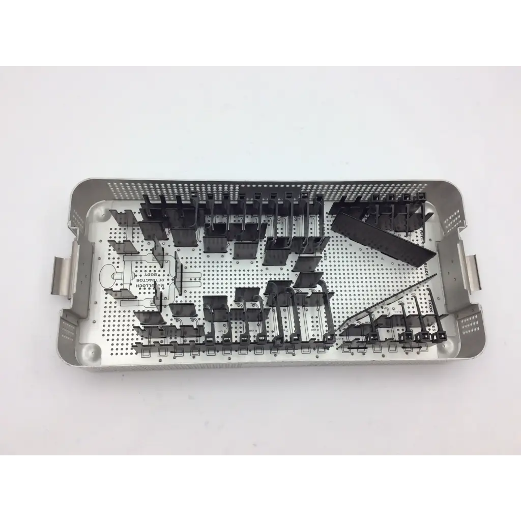 Silver surgical instrument tray with black plastic slots organized for mcculloch retractor instrument tray use