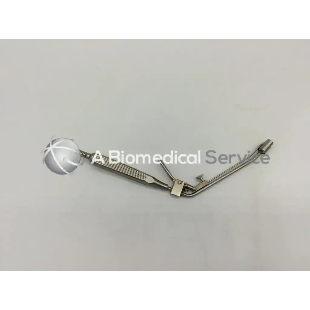 Silver metal McGown 30000 hemorrhoid ligator with spherical head and articulated arms for precise ligation