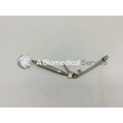 Silver metal McGown 30000 hemorrhoid ligator with spherical head and articulated arms for precise ligation